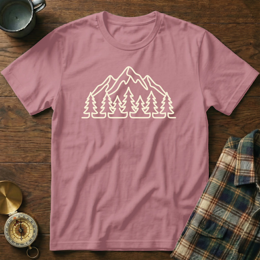 Pink t-shirt with a cream outline graphic of mountains and pine trees.