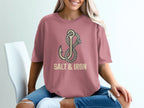 Pink t-shirt with an anchor and rope design, reading "SALT & IRON".