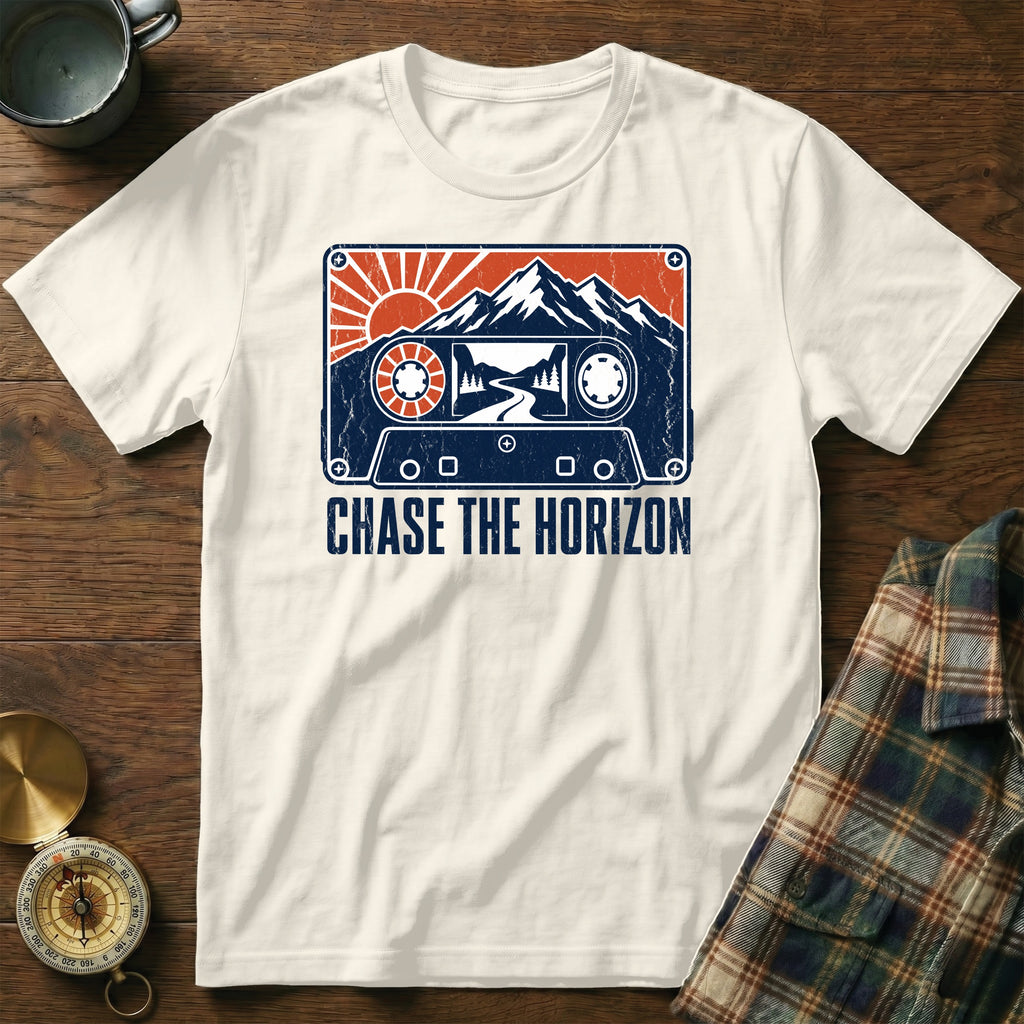 White t-shirt with a distressed cassette tape graphic featuring mountains and text "CHASE THE HORIZON".