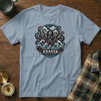 Light blue t-shirt featuring a circular Kraken graphic with waves and anchor.