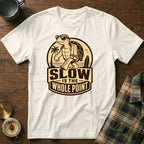 White t-shirt with a graphic of a tortoise walking on a beach, saying "SLOW IS THE WHOLE POINT".