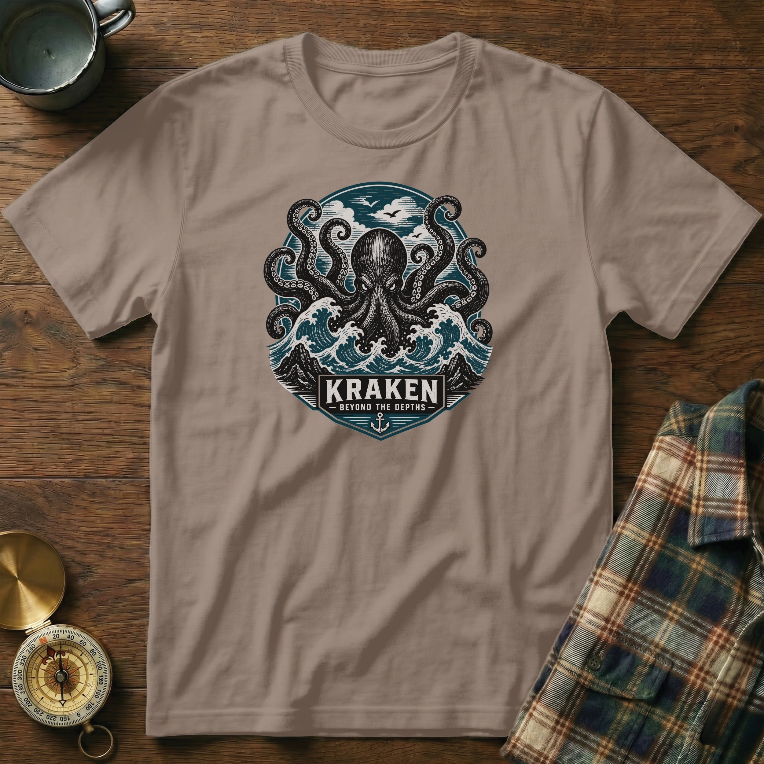 T-shirt with kraken and waves graphic, text "KRAKEN BEYOND THE DEPTHS".
