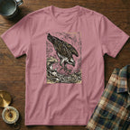 Pink t-shirt with wood grain background featuring an osprey diving for fish.