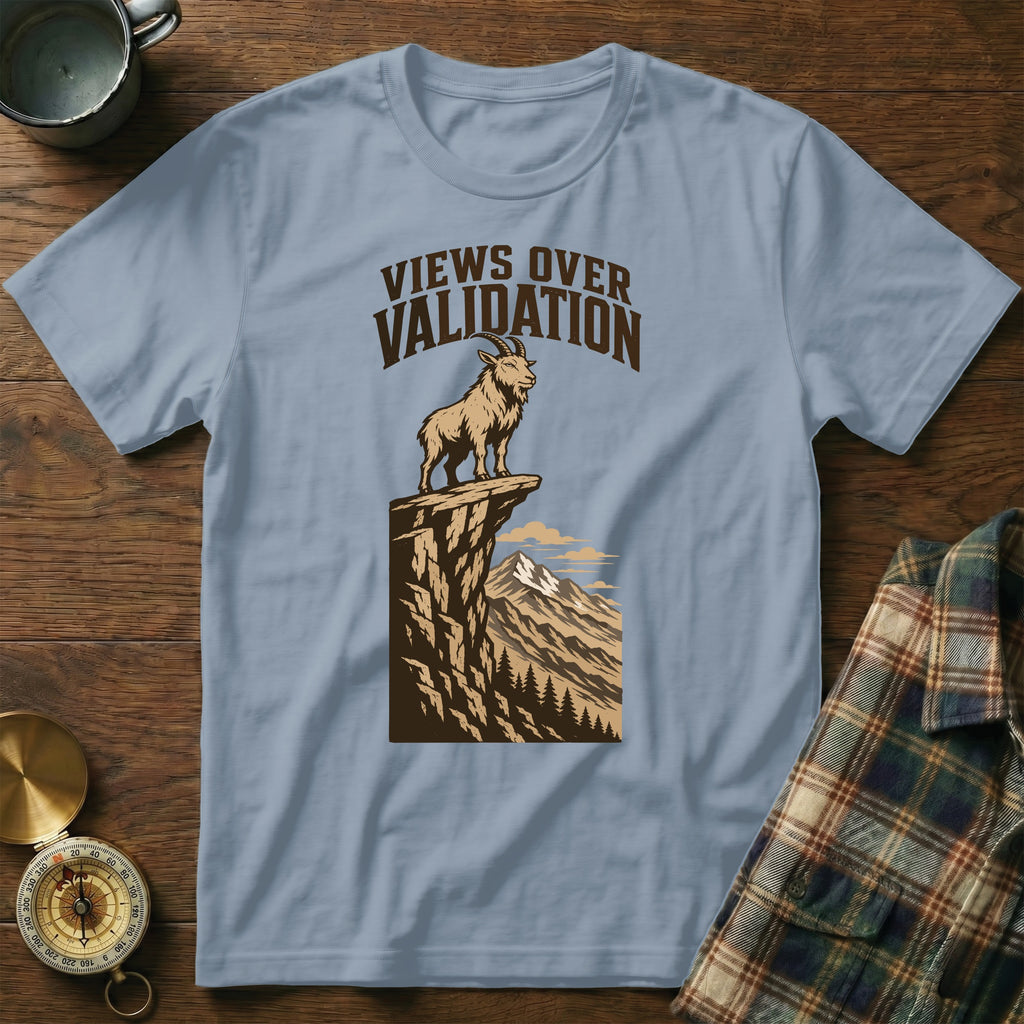Light blue t-shirt with goat on cliff graphic saying "VIEWS OVER VALIDATION".