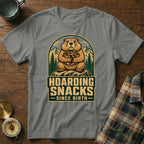 Groundhog holding nuts with "Hoarding Snacks Since Birth" text.