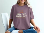 Mauve t-shirt with "SUN OUT BRAIN OFF TEMPORARILY" text and a sun graphic.