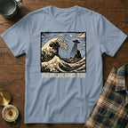 T-shirt with "The Unexplained Tide" text and a wave with a UFO.