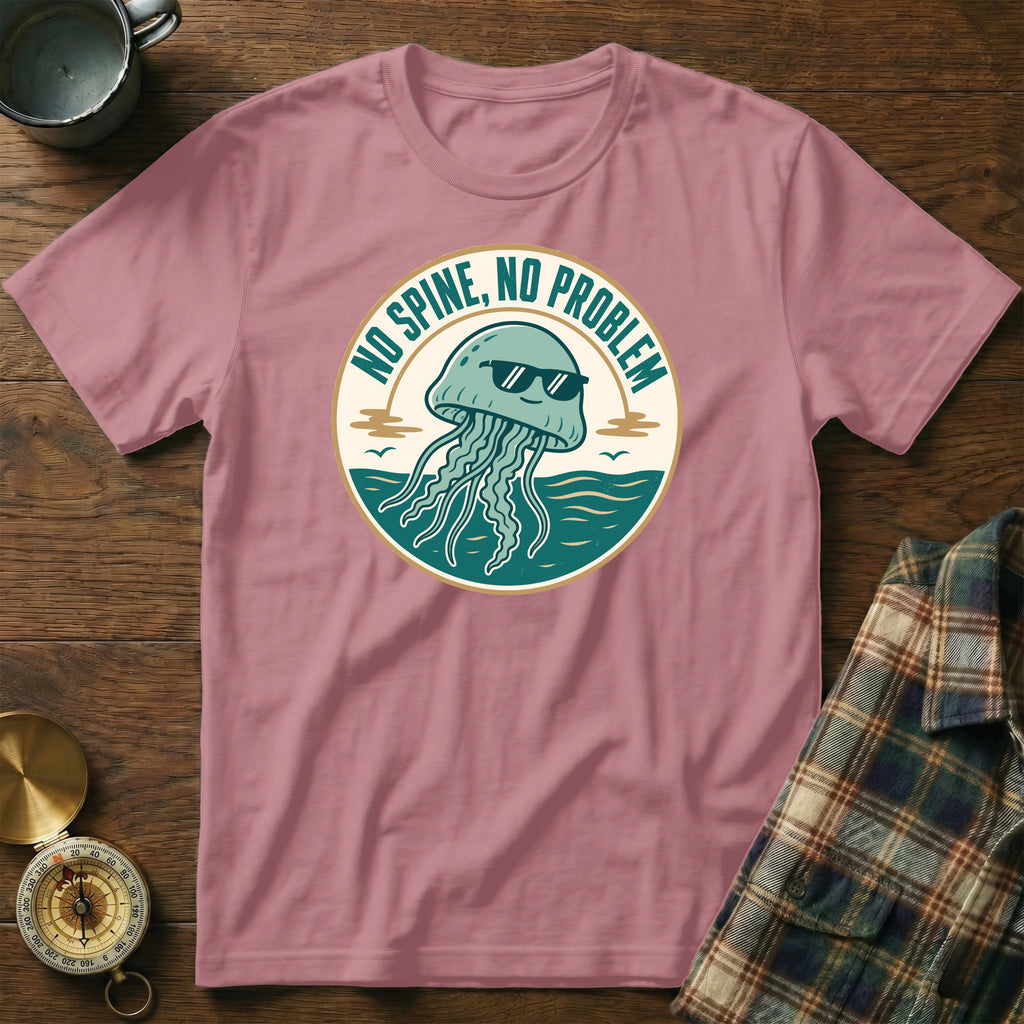 A dusty rose t-shirt with a graphic of a smiling jellyfish wearing sunglasses, stating "No Spine, No Problem."