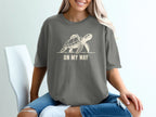 Grey t-shirt with a cream graphic of a turtle carrying a backpack, captioned "ON MY WAY".