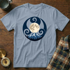 Light blue t-shirt with a circular moon, mountains, and forest design.