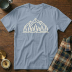 Light blue t-shirt with a cream outline of mountains and pine trees.