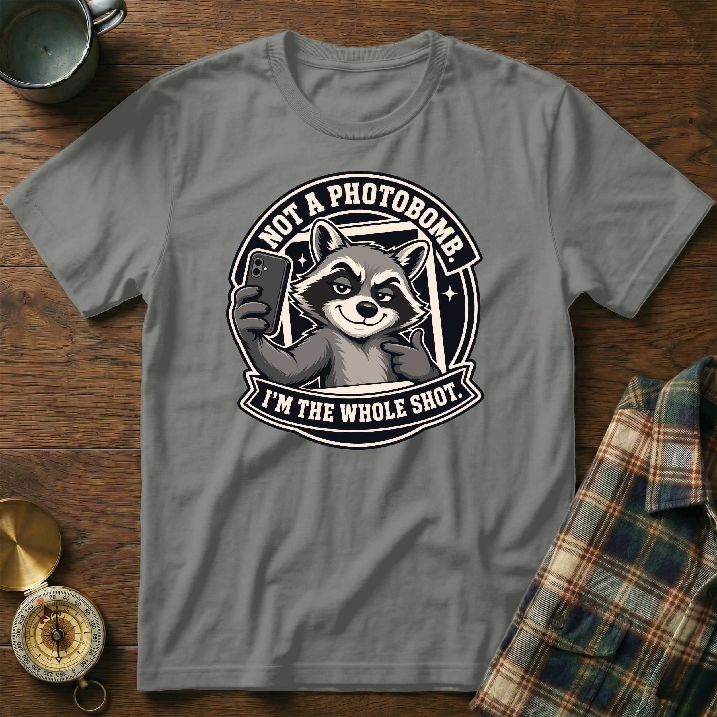 T-shirt graphic of a raccoon taking a selfie with text "NOT A PHOTOBOMB. I'M THE WHOLE SHOT."