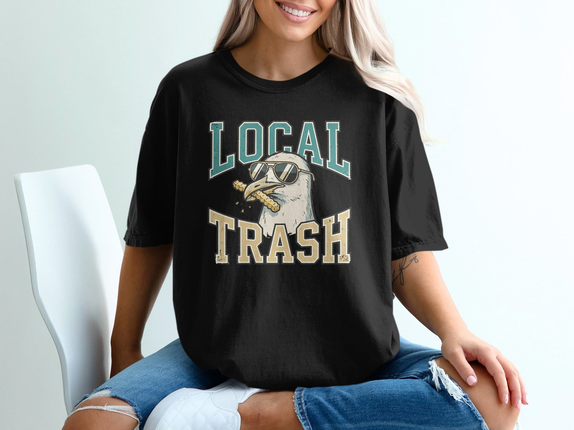 Black t-shirt with a seagull wearing sunglasses and holding a cigarette.