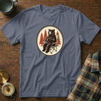 T-shirt graphic of a bear sitting in a chair with a mug of coffee.