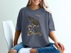 T-shirt featuring an osprey diving for fish in rough waves.