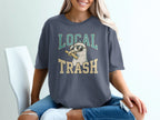 Seagull wearing sunglasses and holding a french fry, with "LOCAL TRASH" text.