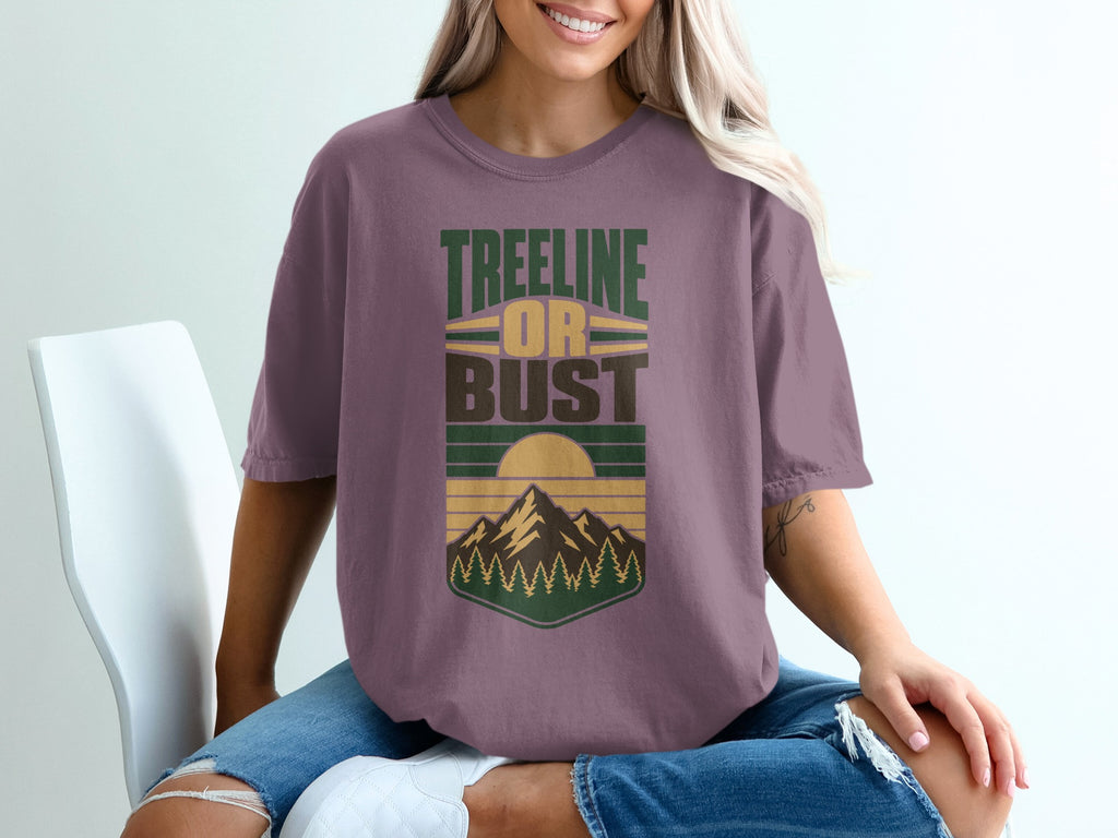 T-shirt with "TREELINE OR BUST" text and mountain and tree graphic.