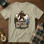 T-shirt with a Bigfoot graphic and text "SPOTTED NOT SORRY."
