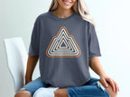 Slate gray t-shirt with a geometric mountain design in orange and cream.