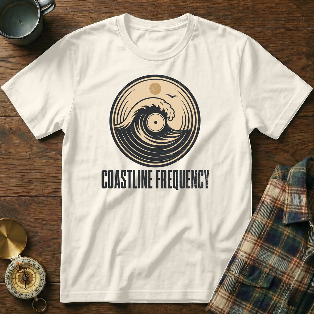 Cream t-shirt with circular wave and record graphic, text "COASTLINE FREQUENCY".