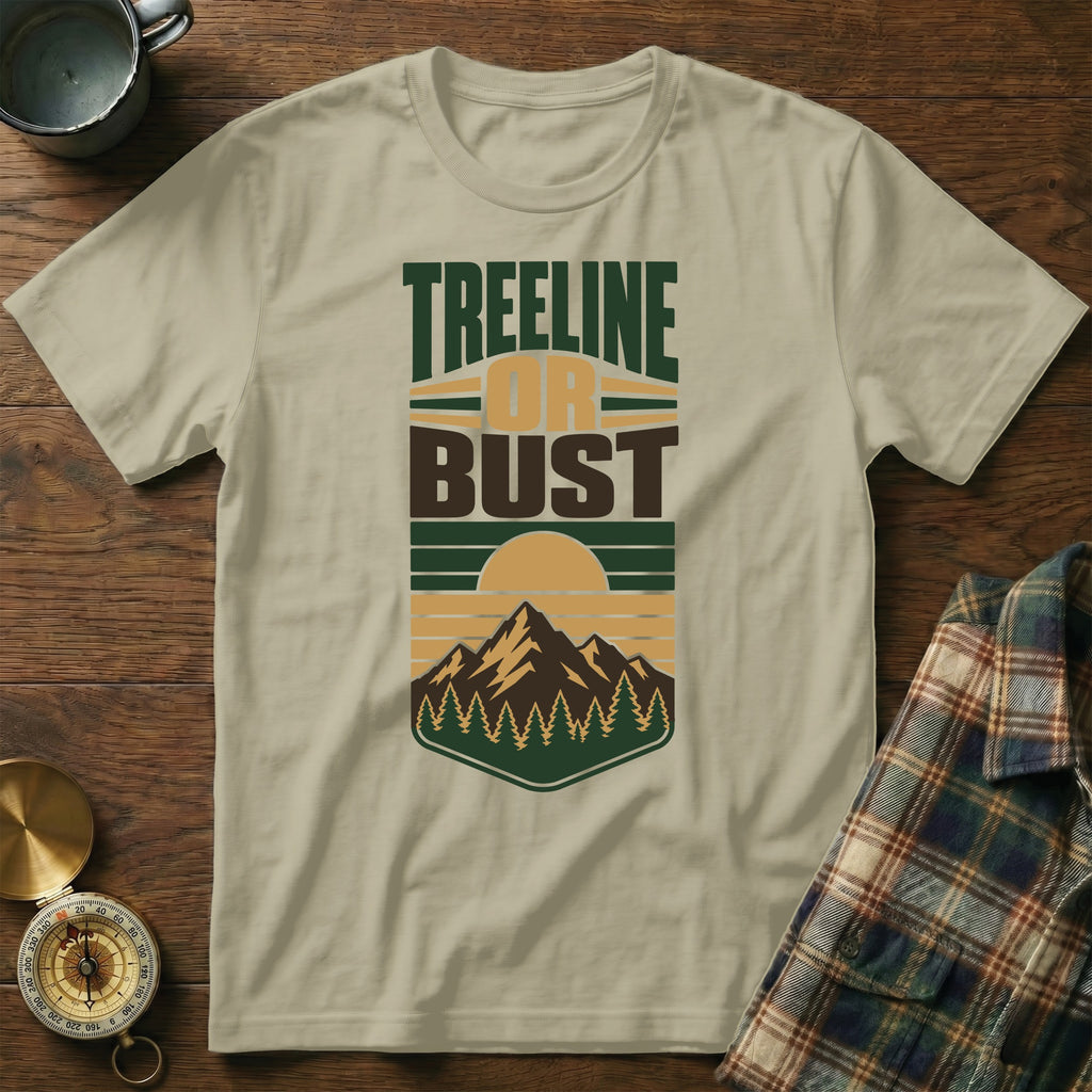 T-shirt with "Treeline or Bust" text and mountain, forest, and sun graphic.