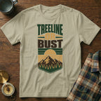T-shirt with "Treeline or Bust" text and mountain, forest, and sun graphic.