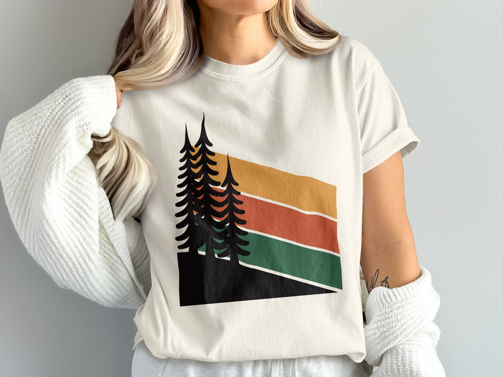 Cream t-shirt with abstract sunset trees graphic.