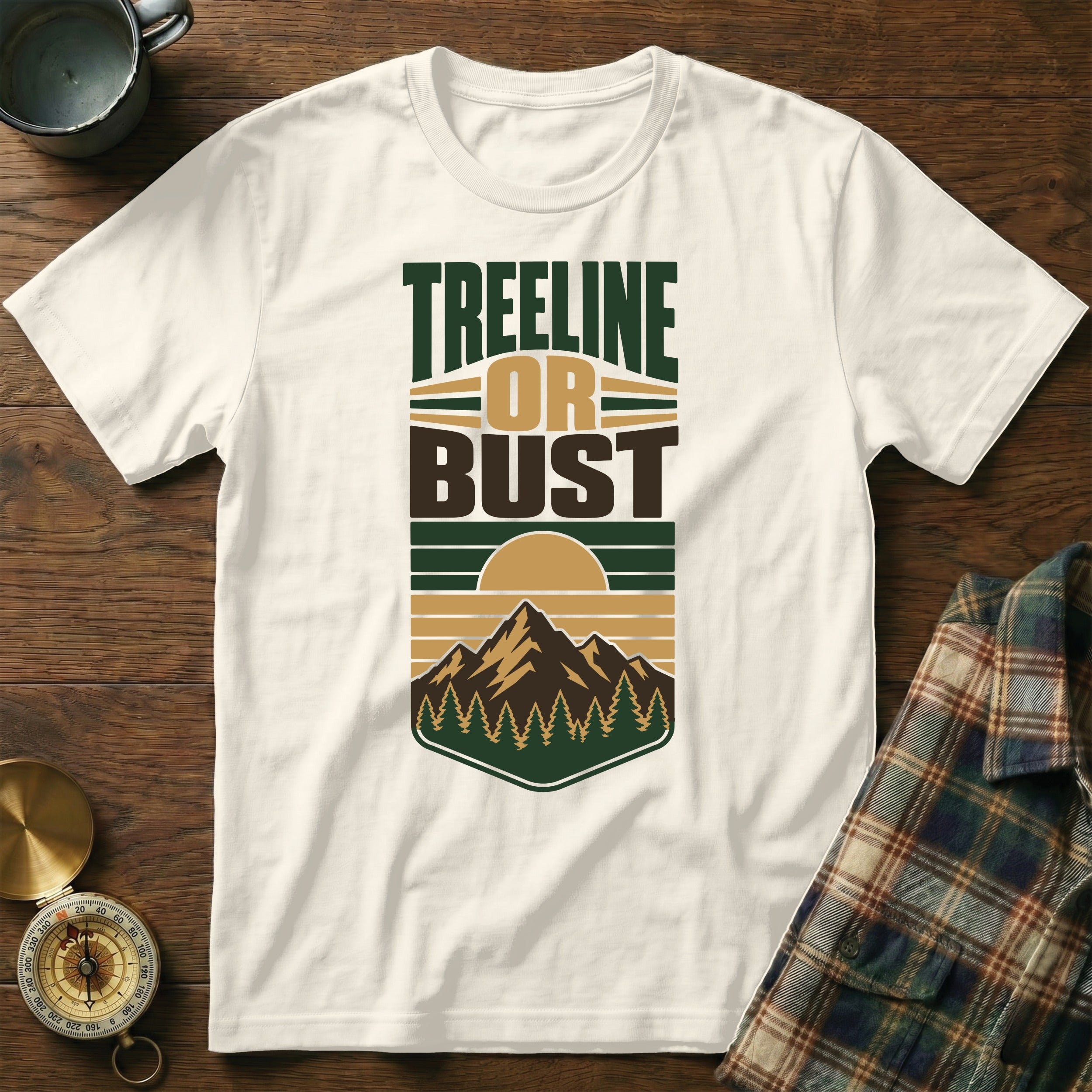 Cream t-shirt with "TREELINE OR BUST" text and mountain graphic.