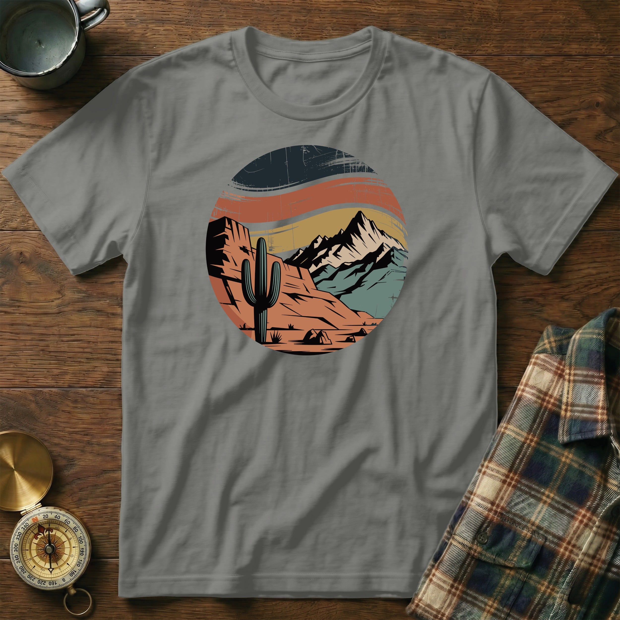 T-shirt with desert mountain landscape featuring a saguaro cactus.