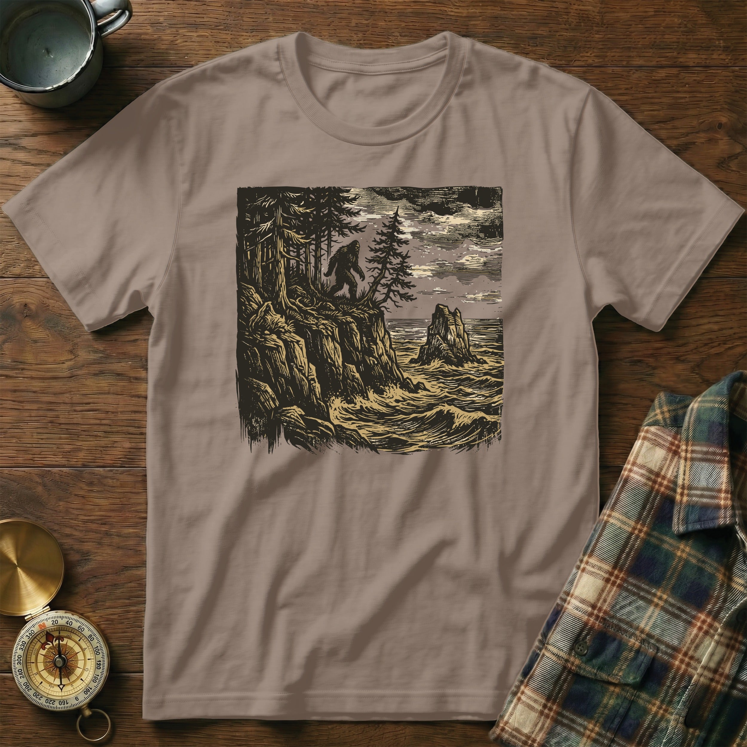 Bigfoot standing on a cliff overlooking a rocky, wavy ocean and forest.