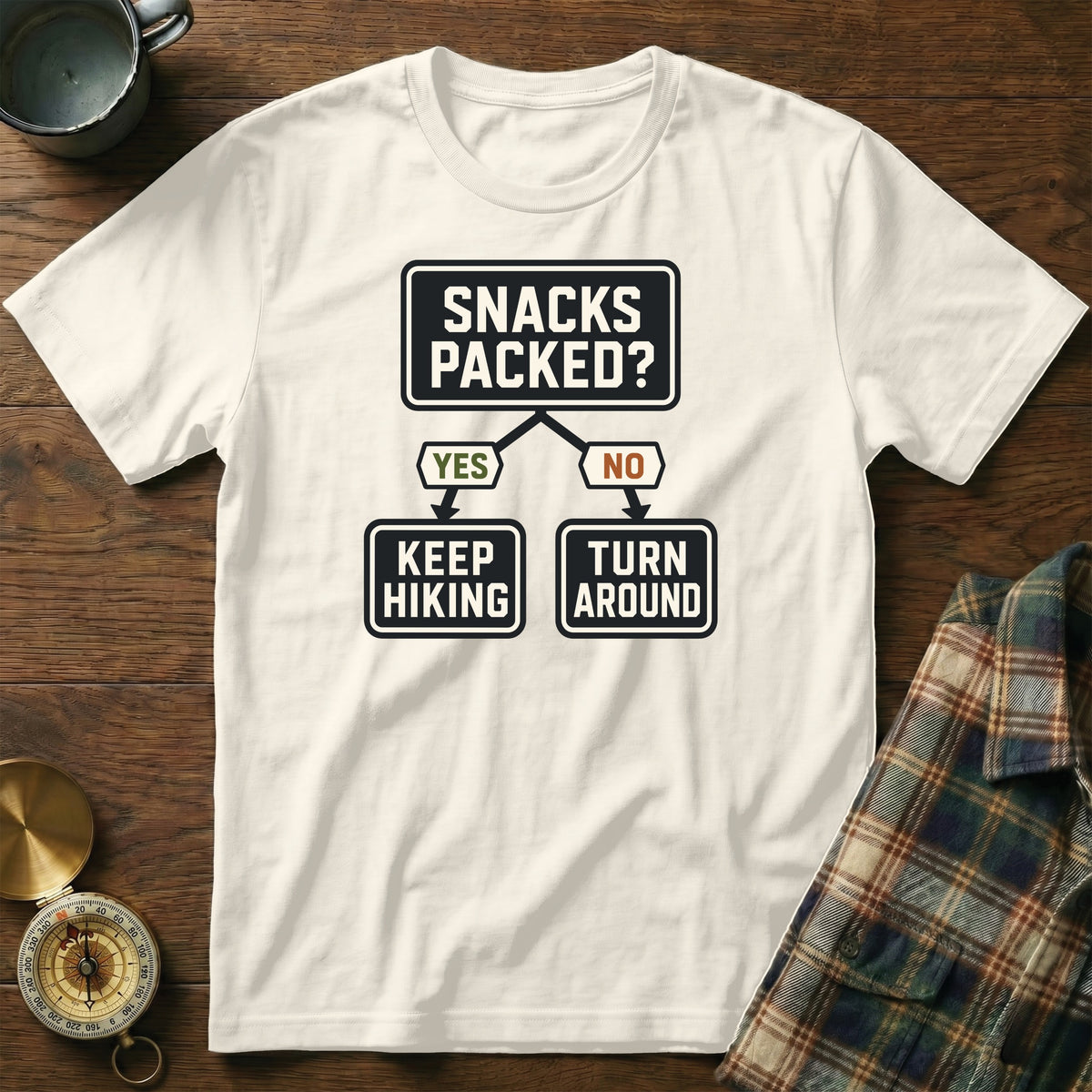 White t-shirt with a "Snacks Packed?" flowchart graphic.