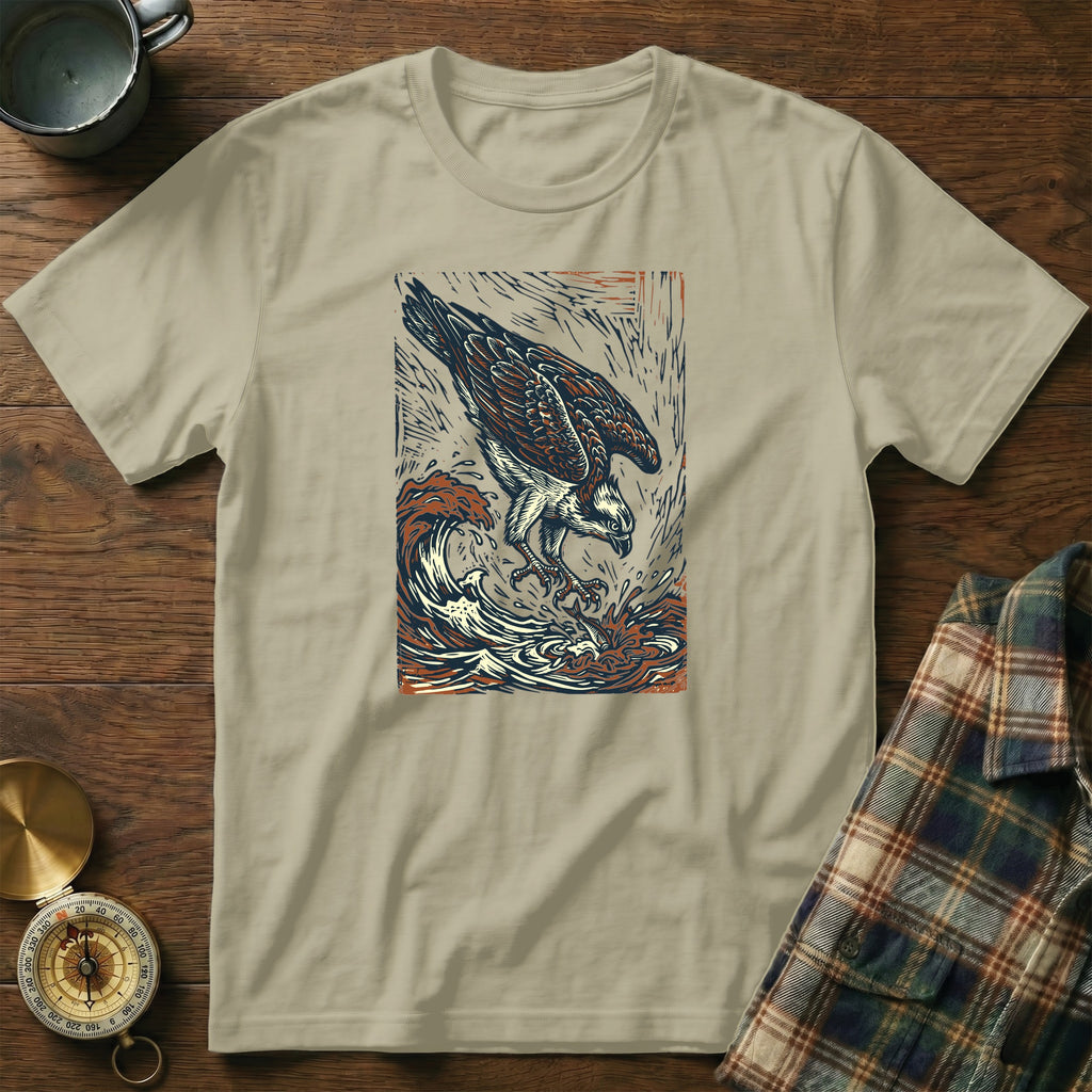 Osprey diving into waves, vintage artistic illustration on tan t-shirt.