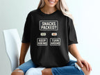 Black t-shirt with "Snacks Packed?" flowchart: "Yes" leads to "Keep Hiking," "No" leads to "Turn Around."