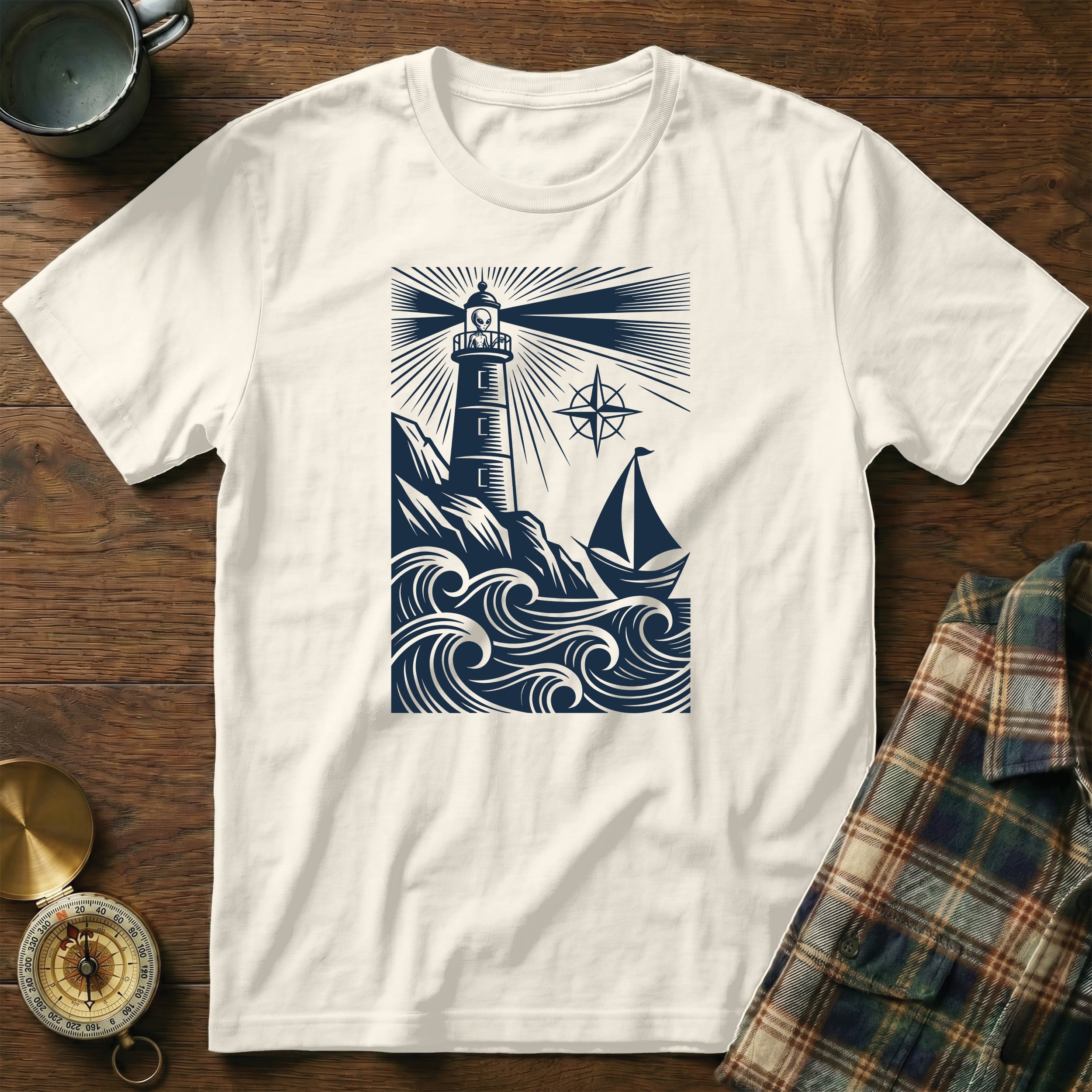 T-shirt design with lighthouse, sailboat, and waves.