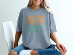 Blue t-shirt with orange and green text reading "The tide went out so did my patience".