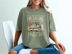 T-shirt with "The mountains are calling, the wifi and internet I must go" text and mountain graphic.