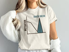 White t-shirt with a graph showing motivation dropping then spiking with "SNACK BREAK" text.