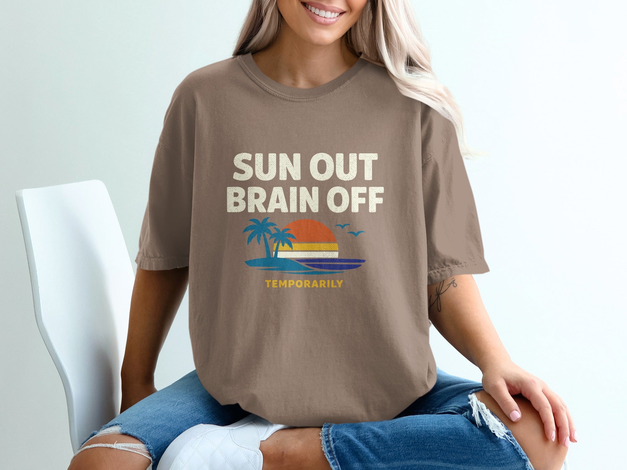 Brown t-shirt with "SUN OUT BRAIN OFF TEMPORARILY" text and beach graphic.
