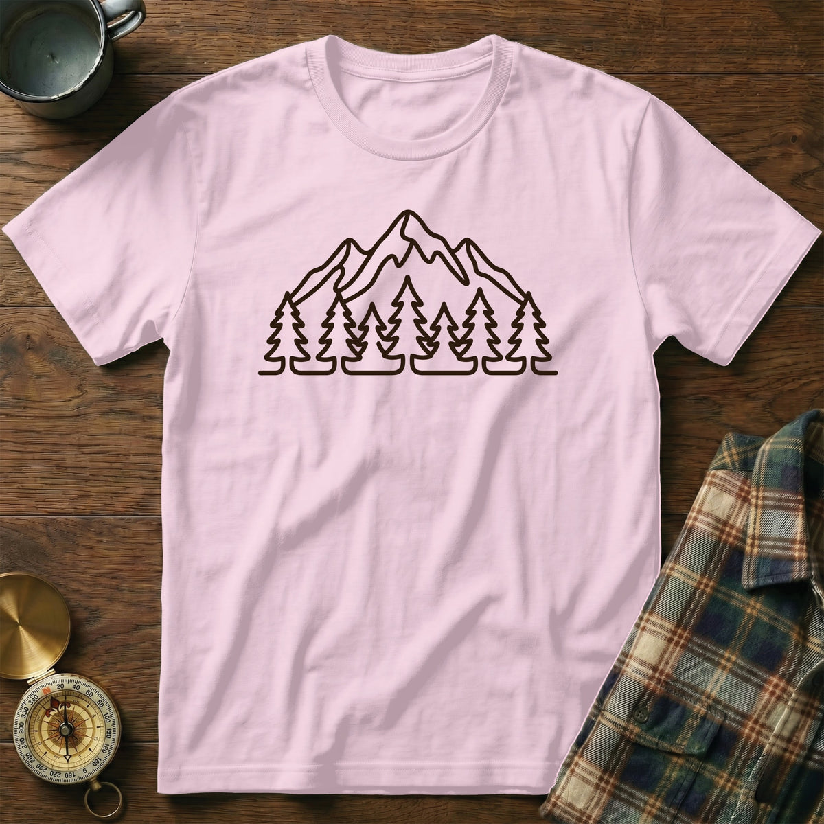 Light pink t-shirt with black outline mountain and tree graphic.