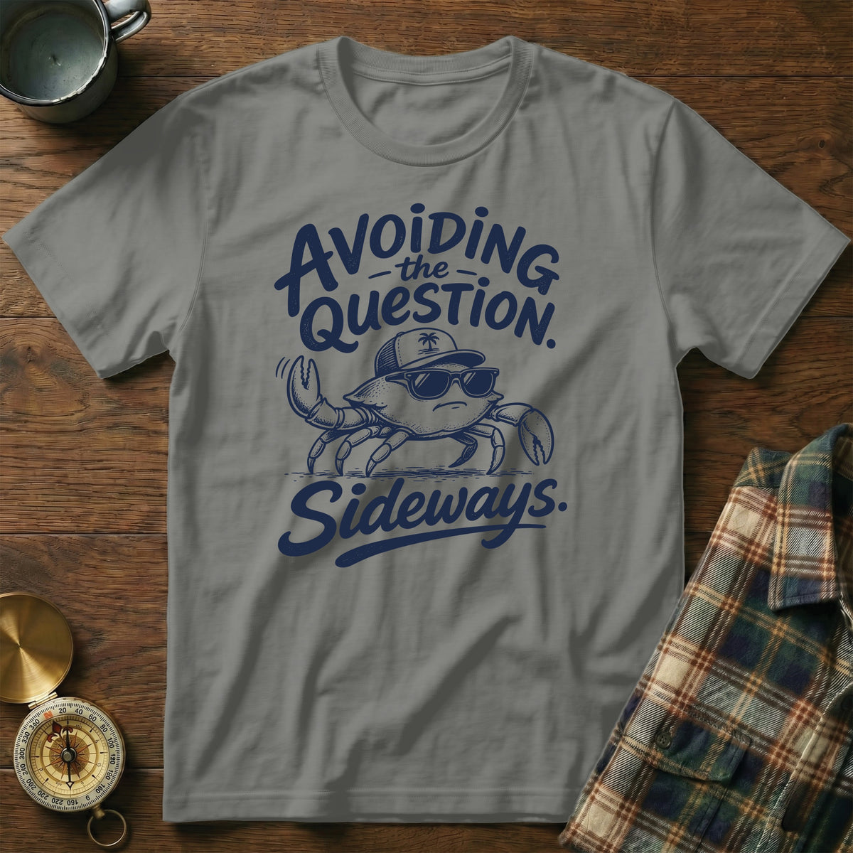 Gray t-shirt featuring blue text that reads Avoiding the Question Sideways and a crab wearing sunglasses.