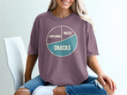 Purple t-shirt with pie chart graphic: complaining, miles, and snacks.