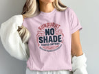 Pink t-shirt with "Sunburnt No Shade Stayed Anyway Vacation Ruined Successfully" text.