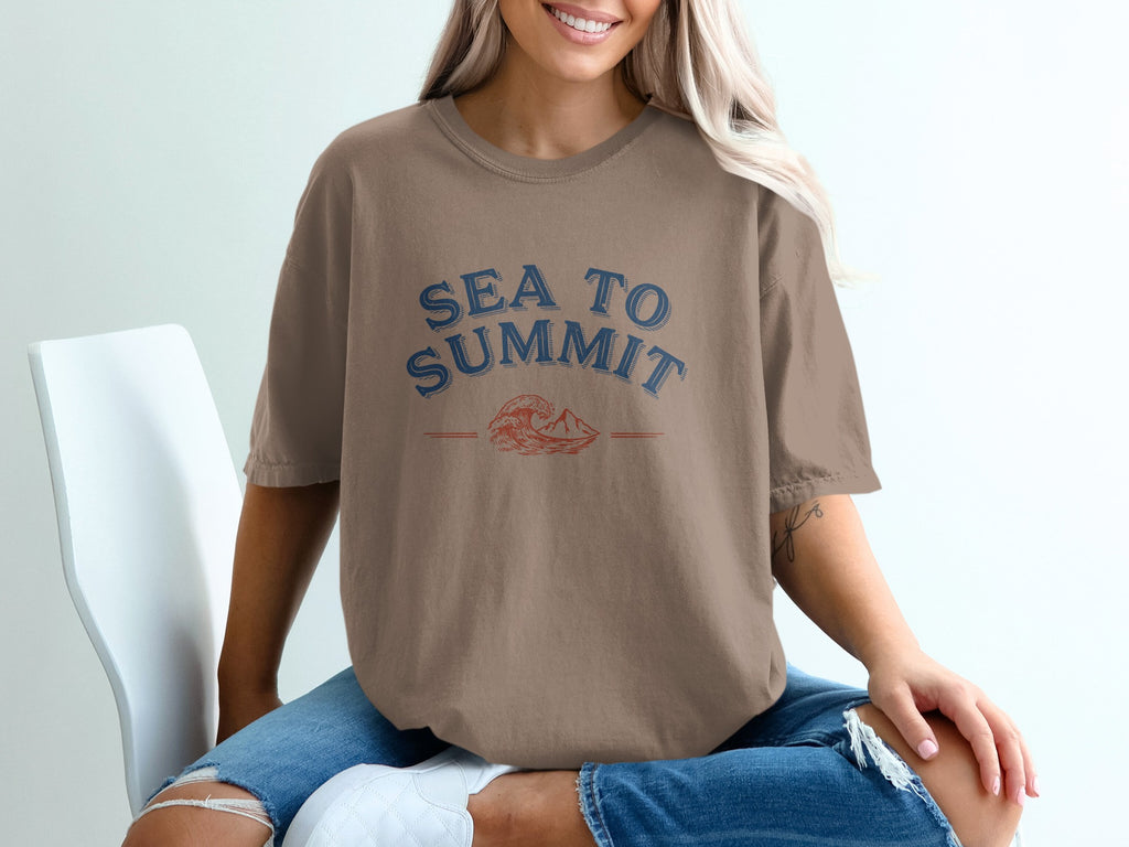 Brown t-shirt with "SEA TO SUMMIT" graphic featuring a wave and mountain.