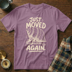 T-shirt with text "JUST MOVED AGAIN" and a hermit crab graphic.