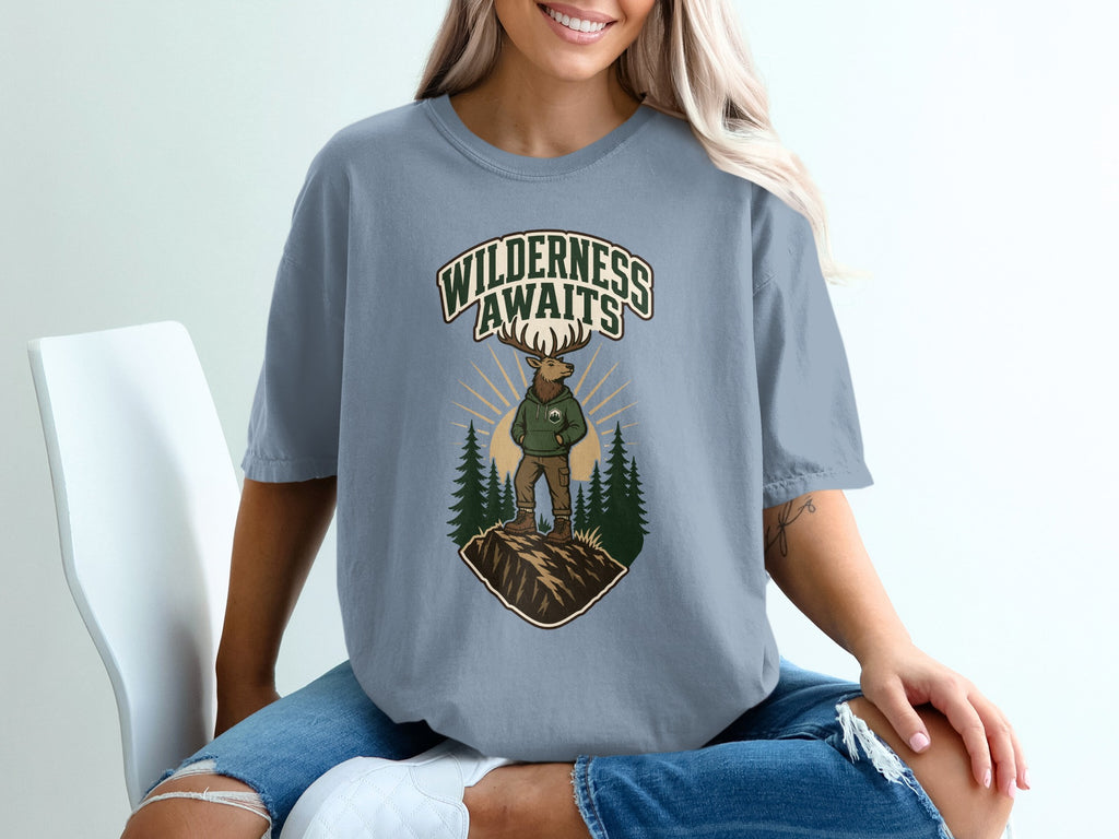 T-shirt with "Wilderness Awaits" text and an elk graphic in a forest scene.