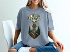 T-shirt with "Wilderness Awaits" text and an elk graphic in a forest scene.