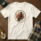 White t-shirt with graphic of bear sitting in a camping chair holding a mug.