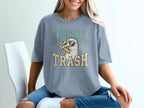 Seagull wearing sunglasses eating french fries, "Local Trash" text.