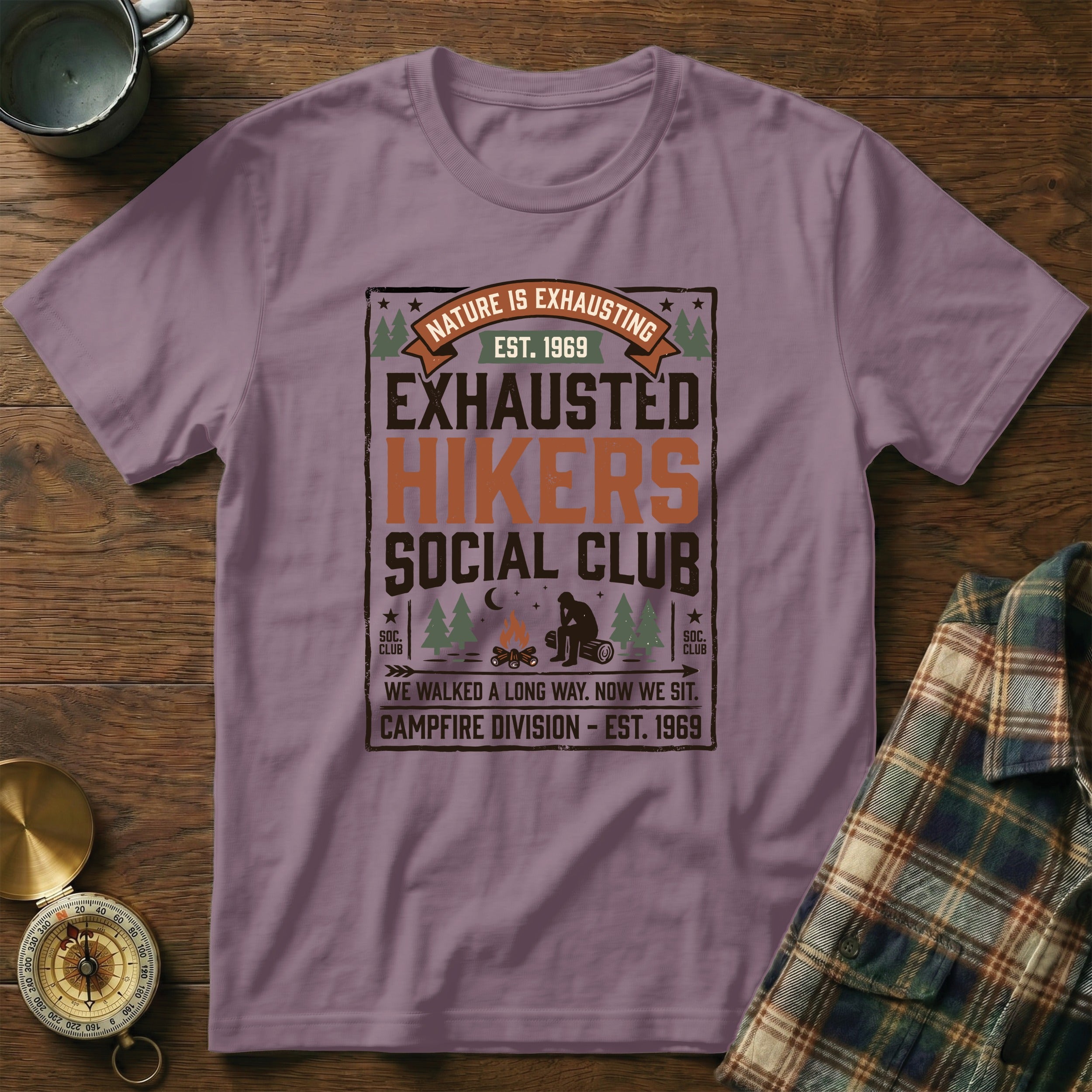 Purple t-shirt with "Exhausted Hikers Social Club" text and camping graphics.