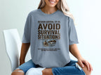 T-shirt with "Outdoor Survival Tip #4: Avoid Survival Situations" text.